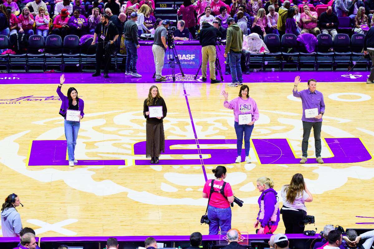 Four LSU employees were honored for their work at an LSU Women's Basketball Game Four LSU employees were honored for their work at an LSU Women's Basketball Game