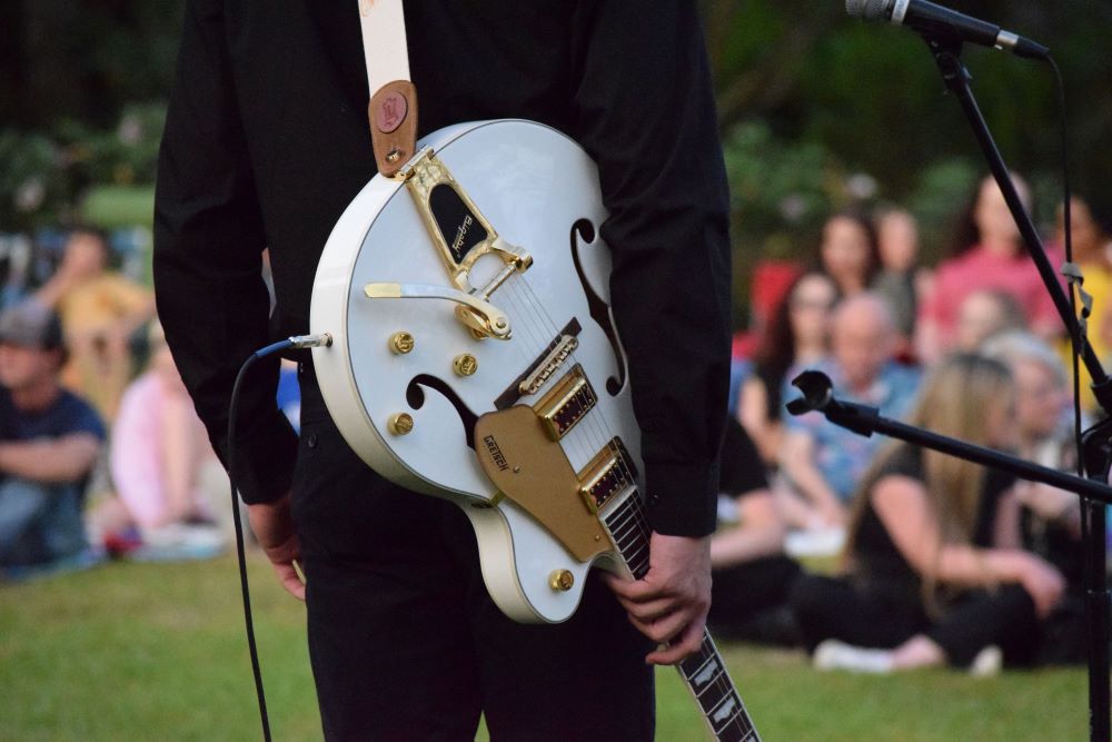 guitar on stage at music in the gardens event