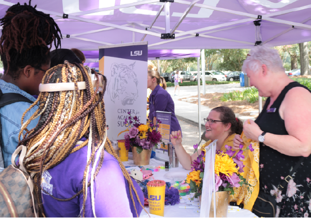 Decorative: Students speaking with CAS staff