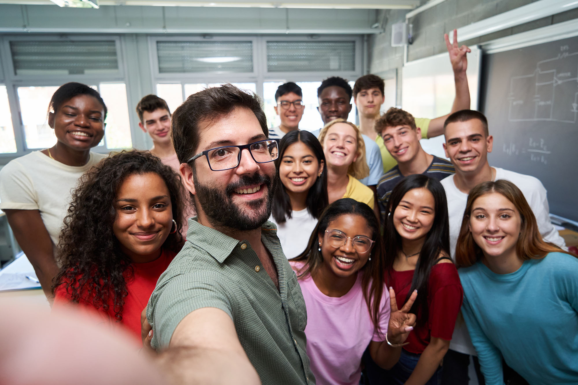 teacher taking a selfie with class