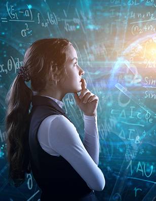 Photo of a young girl standing in front of a blackboard covered in mathmatical symbols.